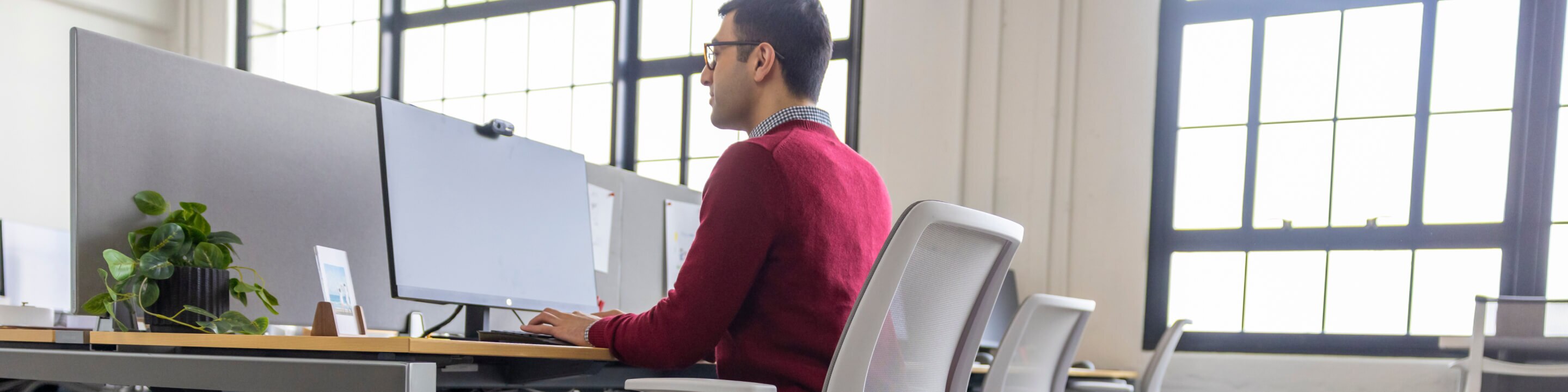 Man sitting at desk learning about his new position